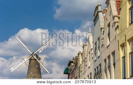 Old Houses And Windmill In The Center Of Leiden