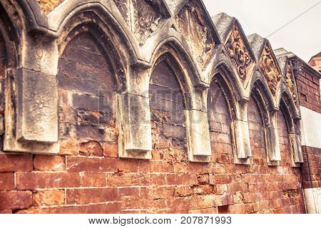 details of  medieval bricks wall with arches