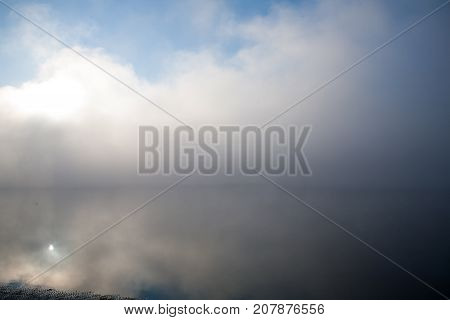 Morning on the river early morning reeds mist fog and water surface on the river