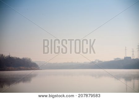 Morning on the river early morning reeds mist fog and water surface on the river