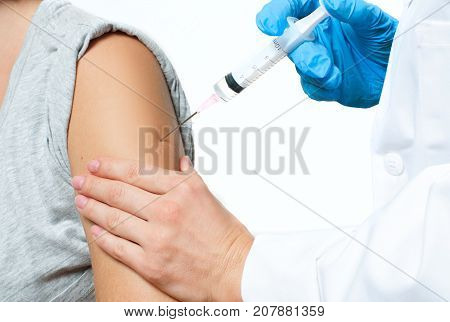 Vaccination. Doctor Injecting Flu Vaccine To Patient's Arm.