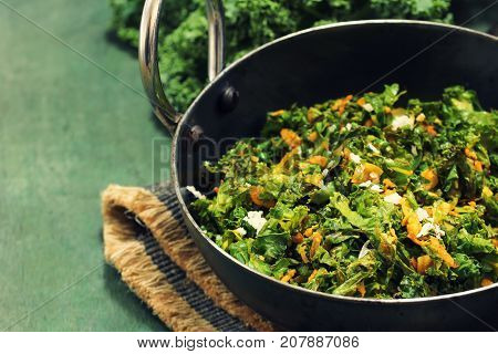 Kale leaves stir fried with Turmeric and coconut selective focus
