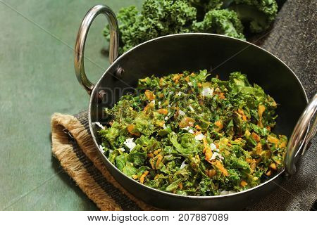 Kale leaves stir fried with Turmeric and coconut selective focus