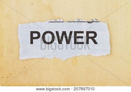 Power newspaper cutout in an old paper background.