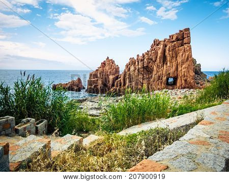 red porphyry rocks in arbatax, sardinia, italy