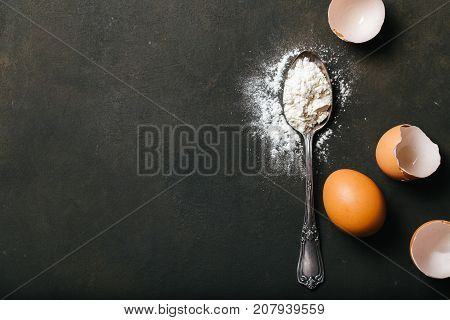Baking or cookingbackground with raw eggs and flour