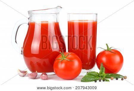 Tomato Juice In Glass Jug With Tomato, Garlic, Spices, And Basil Isolated On White Background