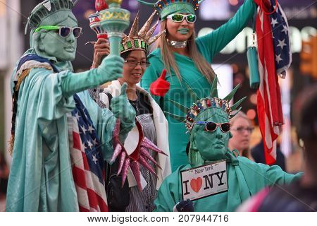 NEW YORK CITY - AUG. 29 : Unidentified people on the Times Square in Manhattan on August 29 2017 in New York City NY. Times Square is a major tourist destination and entertainment center.