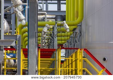 The different colored pipes in the installation of a petrochemical plant