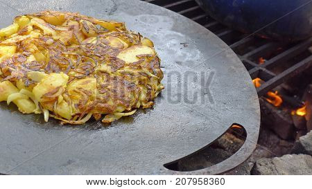 Garden cooked patato frittata baked on open fire