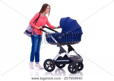 Full length portrait of a mother with a stroller, isolated on white background. Young mom