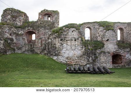 The ruins of the Livonia Order Castle was built in the middle of the 15th century. Bauska Latvia in autumn. Latvian flag on the top of the tower