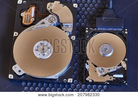 A 3.5 inch desktop and a 2.5 inch laptop hard disk side by side