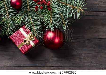 Red Christmas  Gift  Box With Red Ribbon And Fir Branches