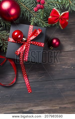 Black Christmas  Gift  Box With Red Ribbon And Fir Branches
