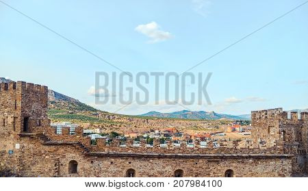Genoese fortress in Sudak, the Crimea Peninsula, Black sea. Consular castle and the fortification wall of the upper tier. Part of the wall, Museum-reserve 