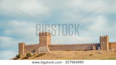Genoese fortress in Sudak, the Crimea Peninsula, Black sea. Consular castle and the fortification wall of the upper tier. Part of the wall, Museum-reserve 