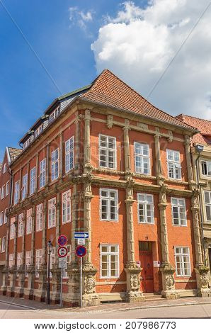 LUNEBURG, GERMANY - MAY 21, 2017: Colorful orange house in the historic center of Luneburg Germany
