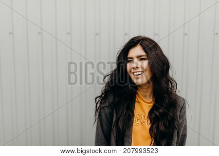 Portrait Of Stylish Modern Young Curly Woman