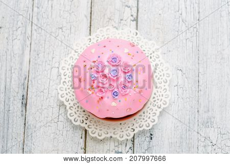 Traditional Easter bread or cake with decorations on wooden table