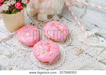 Traditional Easter cupcake with decorations and cupcakes on wooden table