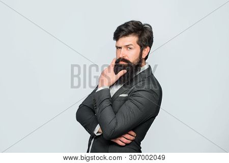Thoughtful Handsome Male. Attractive Bearded Man In Suit. Pensive Business Man With Hand On Chin. Bu
