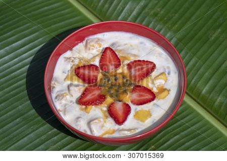 Mango, Passion Fruit, Strawberry And Yogurt Brulee. Fruit Dessert On Breakfast With Wedges Of Perfec