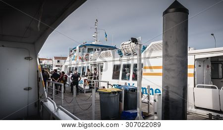 Ferry That Enters The Harbor Of The Island Of Yeu, France