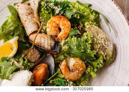 Healthy Salad. Recipe For Fresh Seafood. Grilled Shrimps, Mussels And Squid, Fresh Salad Lettuce And