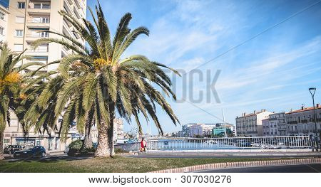 Street Atmosphere On The Stone Bridge Near The Marina Of Sete, France