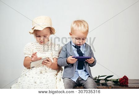 Valentines Day. Happy Childhood. Family Bonds. Small Kid With Red Rose. Formal Little Boy And Girl. 