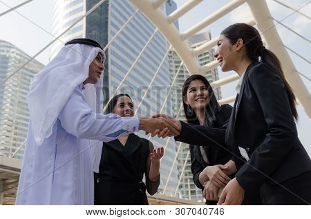 Deal. Welcome. Group Of Arabian Business People Handshake After Finishing Up New Project Plan Busine