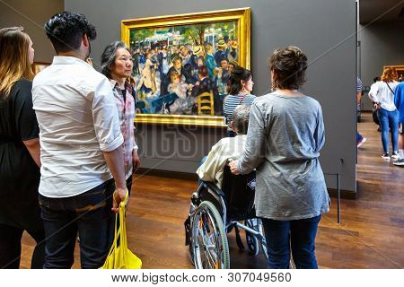 Paris, France - April 20, 2019: Visitors In Art Museum Orsay. People Looking At Artwork Of Impressio