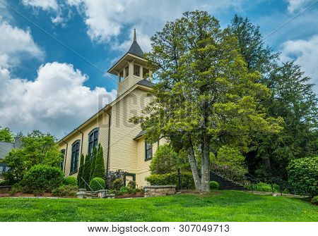 An Old Country Church In Rural North Carolina, Sitting Hillside In Springtime