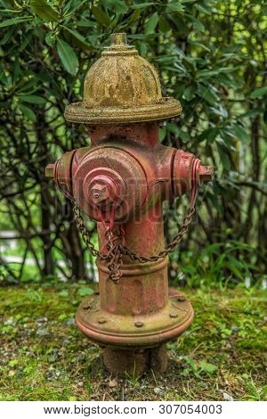 An Old Fire Hydrant With Chipping Paint Still In Use Along A Rural Road In North Carolina, Circa 201