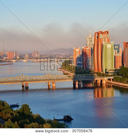 Pyongyang, North Korea - May 5, 2019: Morning View On Taedong River And New Residential Complex, Cap