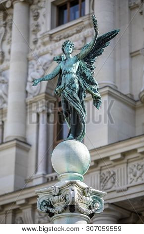 Viena, Austria - March 18, 2019: Iron Sculpture Of Angel On The Kunsthistorisches Museum Background