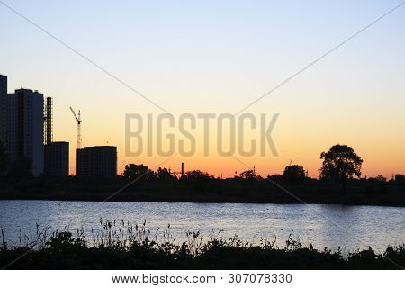 Sunset Or Sunrise In The City. Modern Residential District Near The Pond Of Saint Petersburg, Russia