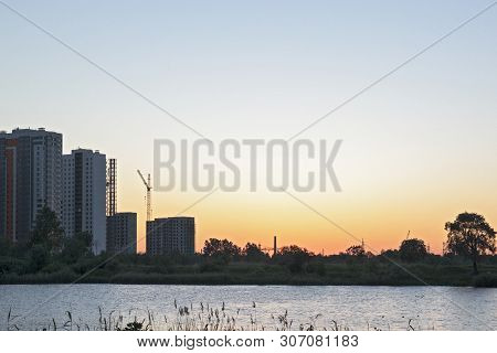 Sunset Or Sunrise In The City. Modern Residential District Near The Pond Of Saint Petersburg, Russia