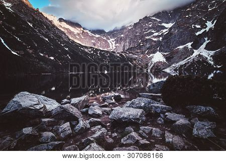 Spectacular View To The Beautiful Mountains With Mirroed Reflection And Clouds At Sunrise Time.