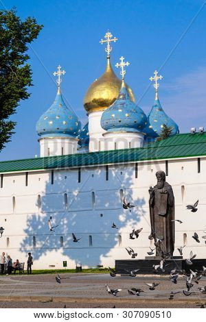Sergiev Posad, Russia - June, 8, 2019: monument to Sergey of Radonezh, founder of Troitse-Sergiyevsky Monastery near the wall of this monastery in Sergiev Posad, Russia