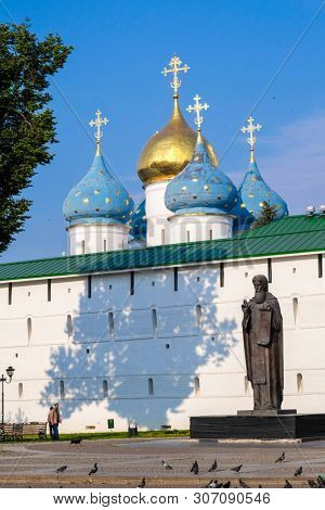 Sergiev Posad, Russia - June, 8, 2019: monument to Sergey of Radonezh, founder of Troitse-Sergiyevsky Monastery near the wall of this monastery in Sergiev Posad, Russia