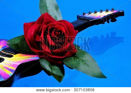 The Guitar Is A Musical Instrument And A Red Rose The Queen Of Flowers. Rose Is A Symbol Of Love, Pa