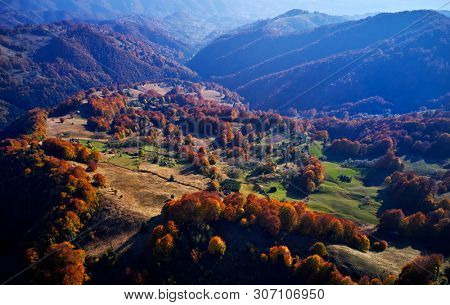 aerial view of Carpathian mountains countryside in autumn morning, Romania