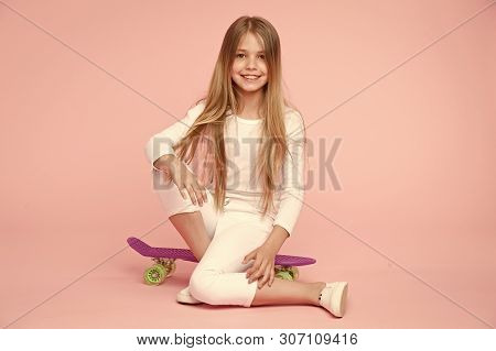 Little Girl Sit On Penny Board. Happy Little Girl Enjoy Happy Childhood. Childhood Development And G