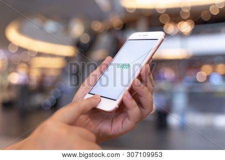 Chiang Mai, Thailand - May.10,2019: Woman Holding Apple Iphone 6s Rose Gold With  Grab Apps On Scree