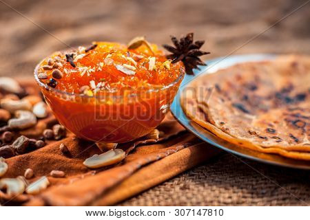 Famous Mango Preservation I.e. Murba Or Murabba In A Glass Bowl On Jute Bags Surface Along With Dry