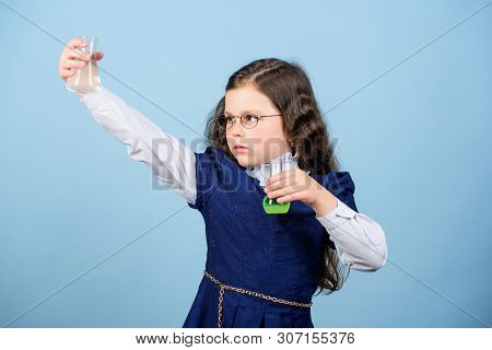 Child Study Bilogy Lesson. Discover Future. Small Girl Scientist With Testing Flask. Education And K