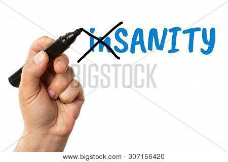 Man Crossing Blue Insanity Text With Black Marker As Turning Into Sanity Mental Health Concept Isola