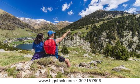 Two Tourist In A Nice Valley In Mountain Pyrenees Of Spain (valley Name Is Vall De Nuria)